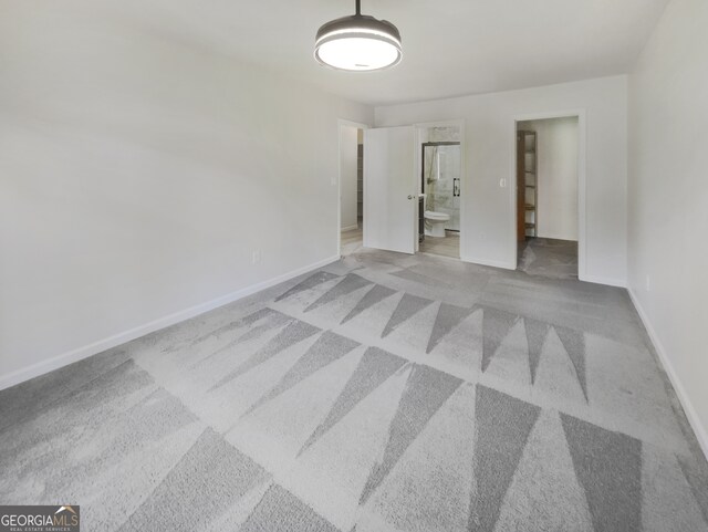 unfurnished room with light carpet