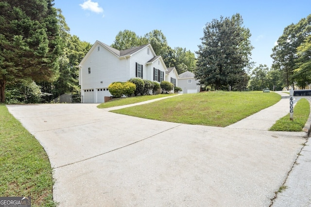 view of home's exterior featuring a lawn and a garage