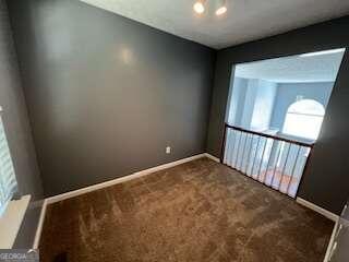 unfurnished room featuring carpet floors