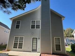 rear view of house featuring a patio area