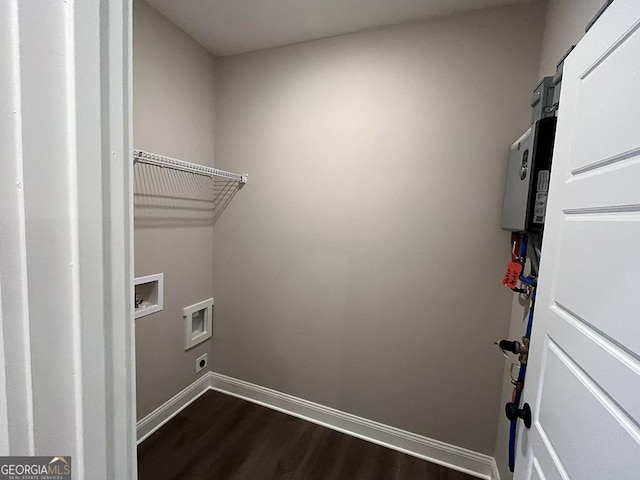 laundry room featuring washer hookup and dark wood-type flooring