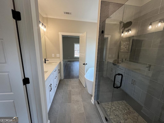 bathroom with vanity, crown molding, and independent shower and bath