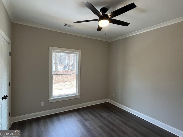 unfurnished room with ornamental molding, ceiling fan, and dark hardwood / wood-style flooring