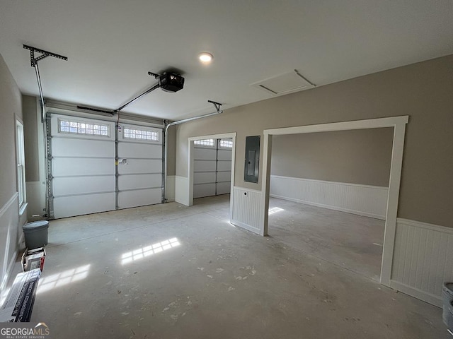 garage featuring a garage door opener and electric panel