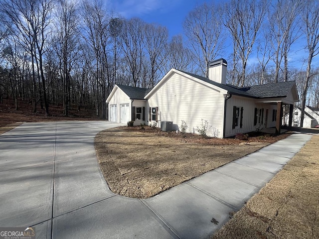 view of side of property featuring central AC unit