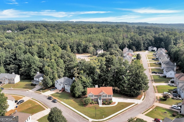 aerial view with a residential view and a view of trees