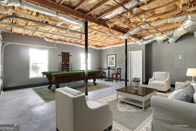 playroom with concrete floors, electric panel, and billiards