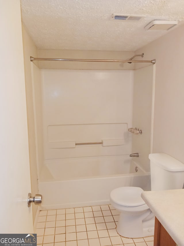 full bathroom with toilet, tile patterned flooring, vanity, a textured ceiling, and bathtub / shower combination