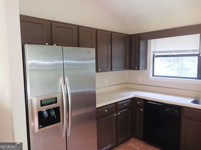 kitchen featuring lofted ceiling, black dishwasher, light tile patterned flooring, stainless steel fridge with ice dispenser, and dark brown cabinetry