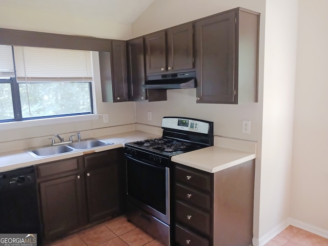 kitchen with gas stove, vaulted ceiling, sink, black dishwasher, and light tile patterned flooring