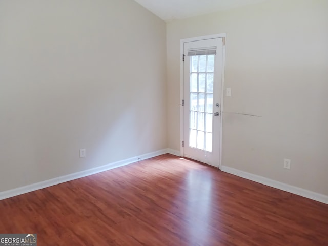 spare room featuring hardwood / wood-style flooring