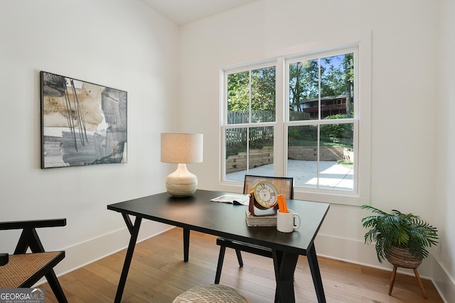 office area featuring baseboards and hardwood / wood-style flooring