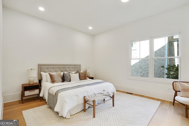 bedroom featuring recessed lighting, baseboards, and wood finished floors