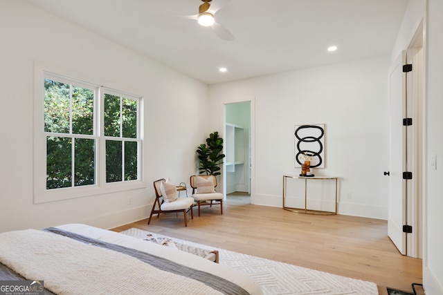 bedroom featuring hardwood / wood-style floors and ceiling fan