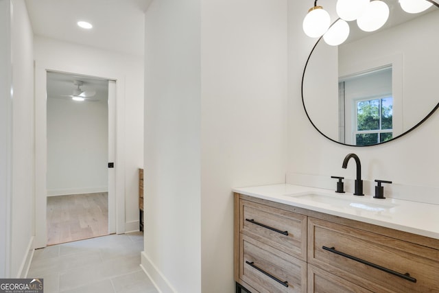 bathroom featuring tile patterned flooring, recessed lighting, vanity, and baseboards