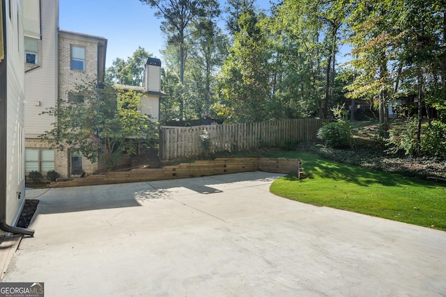 view of patio featuring fence