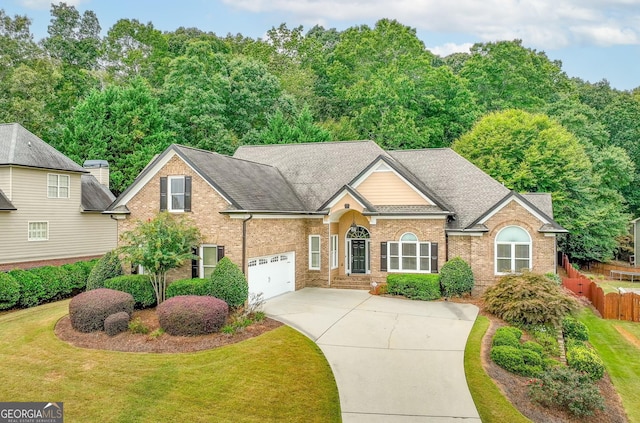 view of property with a front yard and a garage