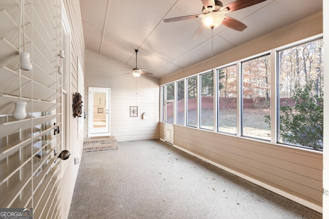 unfurnished sunroom with ceiling fan and lofted ceiling