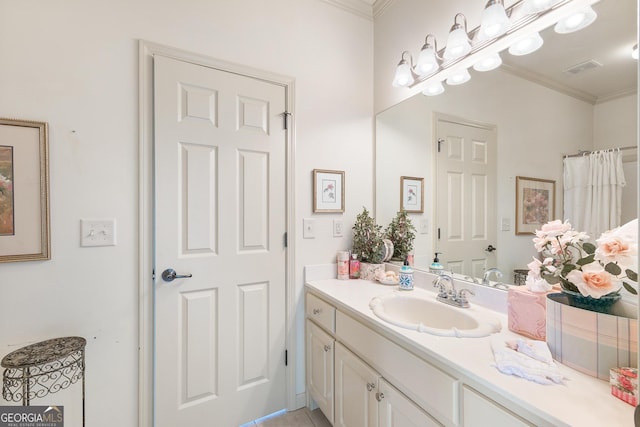 bathroom with vanity, crown molding, and walk in shower