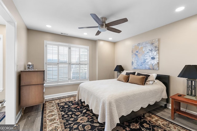 bedroom featuring wood-type flooring and ceiling fan