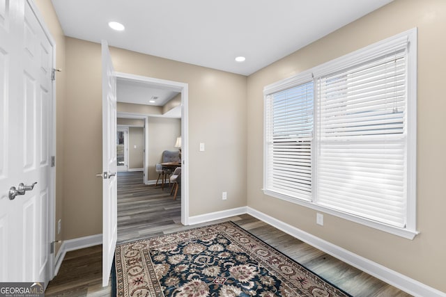 foyer entrance with dark hardwood / wood-style floors