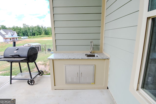 view of patio featuring sink and grilling area