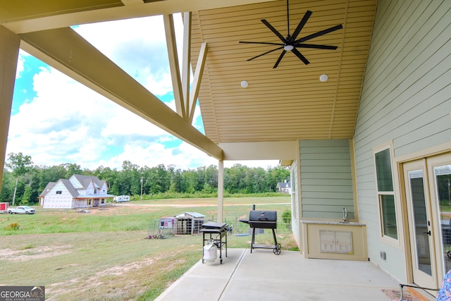 view of patio featuring a grill and ceiling fan