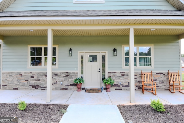 doorway to property with a porch