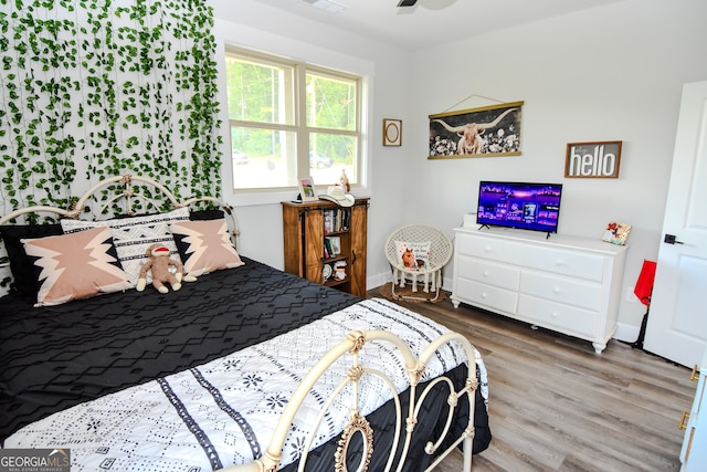 bedroom featuring hardwood / wood-style floors