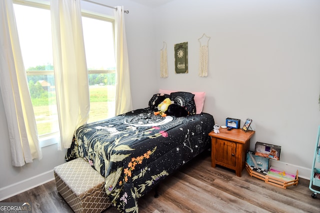 bedroom with wood-type flooring