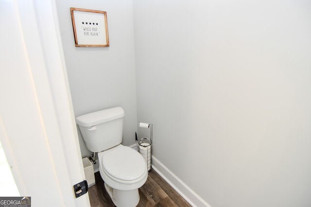 bathroom featuring toilet and hardwood / wood-style flooring