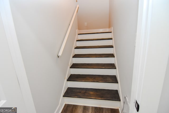 stairway featuring hardwood / wood-style flooring