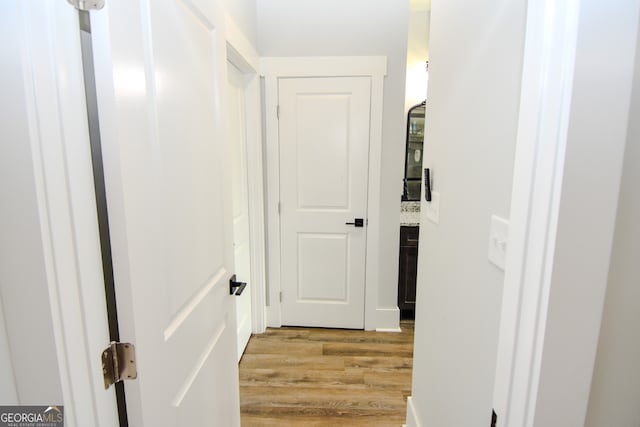 hall with light hardwood / wood-style flooring