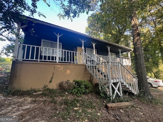 back of house with a porch