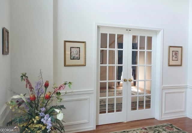 doorway to outside featuring light wood-type flooring and french doors