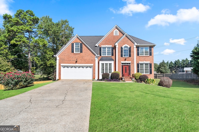 view of front facade with a front lawn and a garage