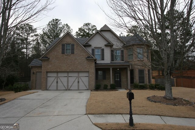 view of front of home with a garage and a front yard