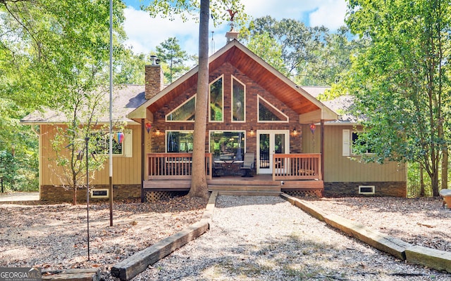 back of house featuring a wooden deck