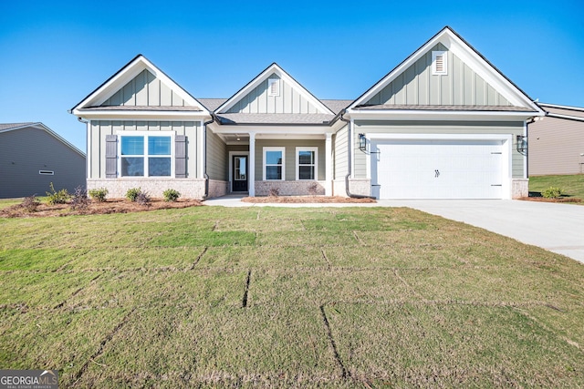 craftsman inspired home with a garage and a front lawn