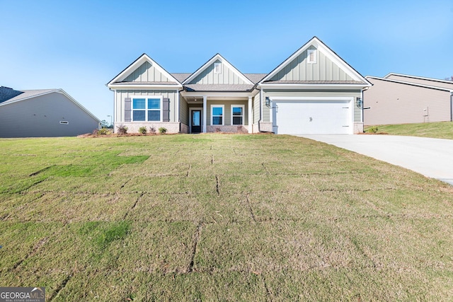 craftsman-style house featuring a garage and a front lawn