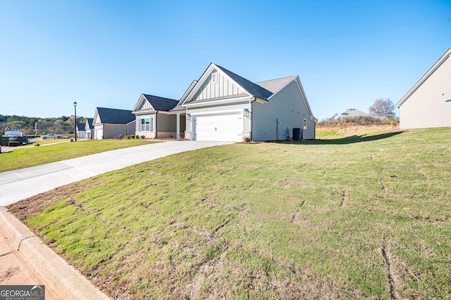 view of front of house with a garage, central air condition unit, and a front lawn