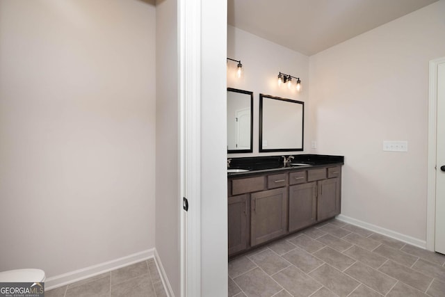 bathroom with tile patterned flooring and vanity