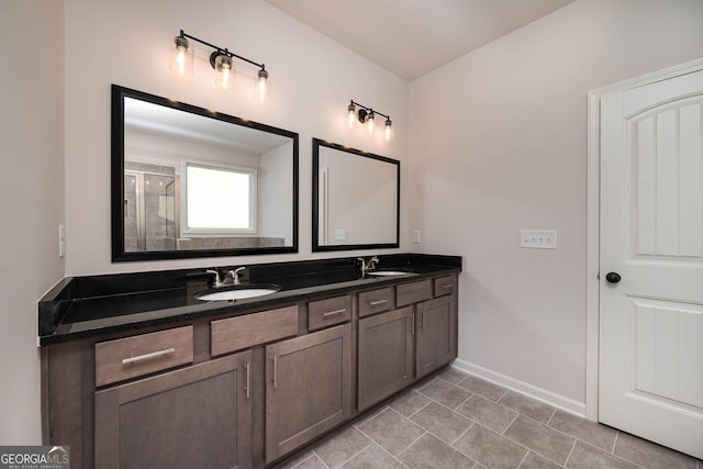 bathroom featuring vanity and an enclosed shower