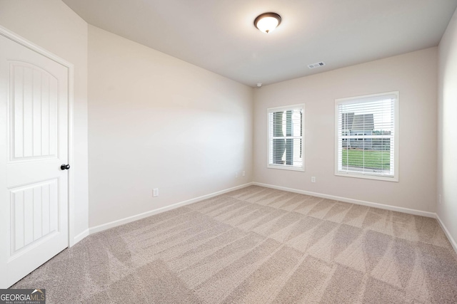 unfurnished room featuring carpet