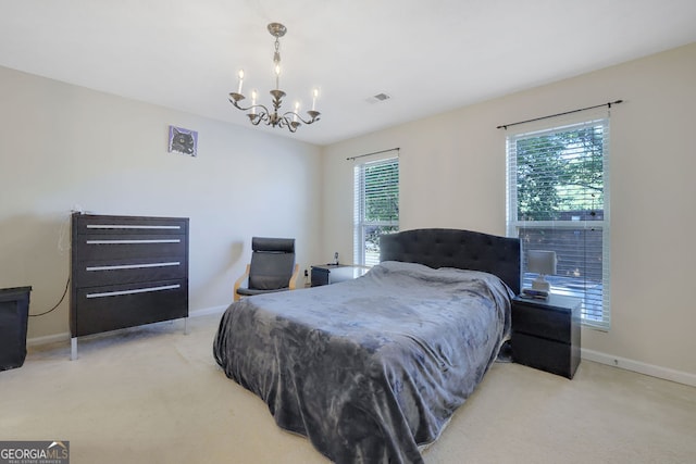 carpeted bedroom with a chandelier and multiple windows