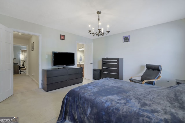 bedroom featuring an inviting chandelier, light carpet, and ensuite bathroom