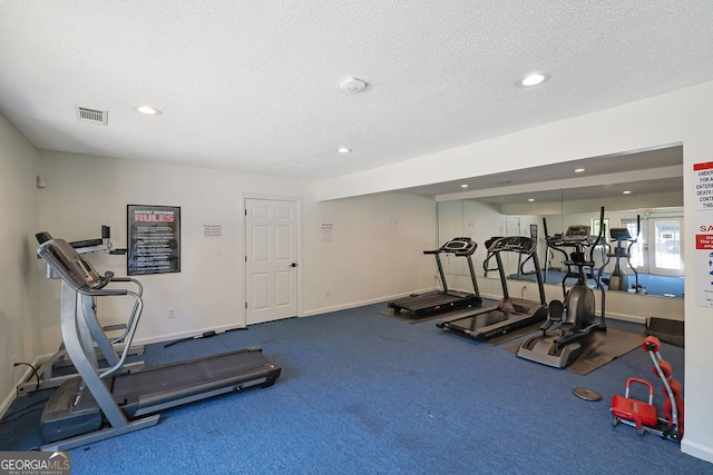 gym with a textured ceiling