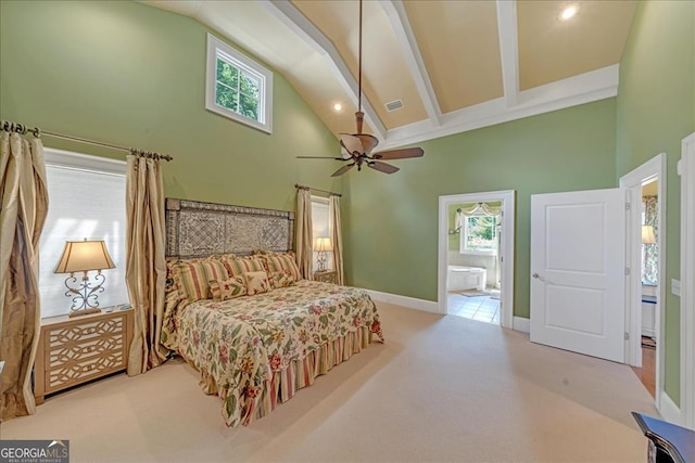 bedroom with beamed ceiling, high vaulted ceiling, ensuite bath, ceiling fan, and light colored carpet