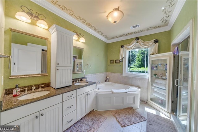 bathroom featuring vanity, separate shower and tub, ornamental molding, and tile patterned floors