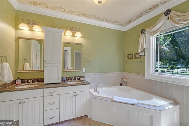 bathroom with a bathtub, crown molding, and vanity